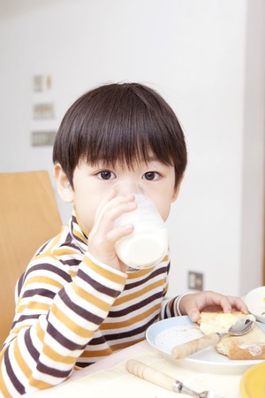 42396530 - boy to drink milk at breakfast